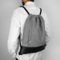 light grey backapck black bottom drawstring bag