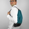 turquise backapck with black bottom drawstring bag