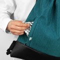 turquise backapck with black bottom drawstring bag