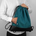 turquise backapck with black bottom drawstring bag
