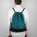 turquise backapck with black bottom drawstring bag
