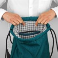 turquise backapck with black bottom drawstring bag